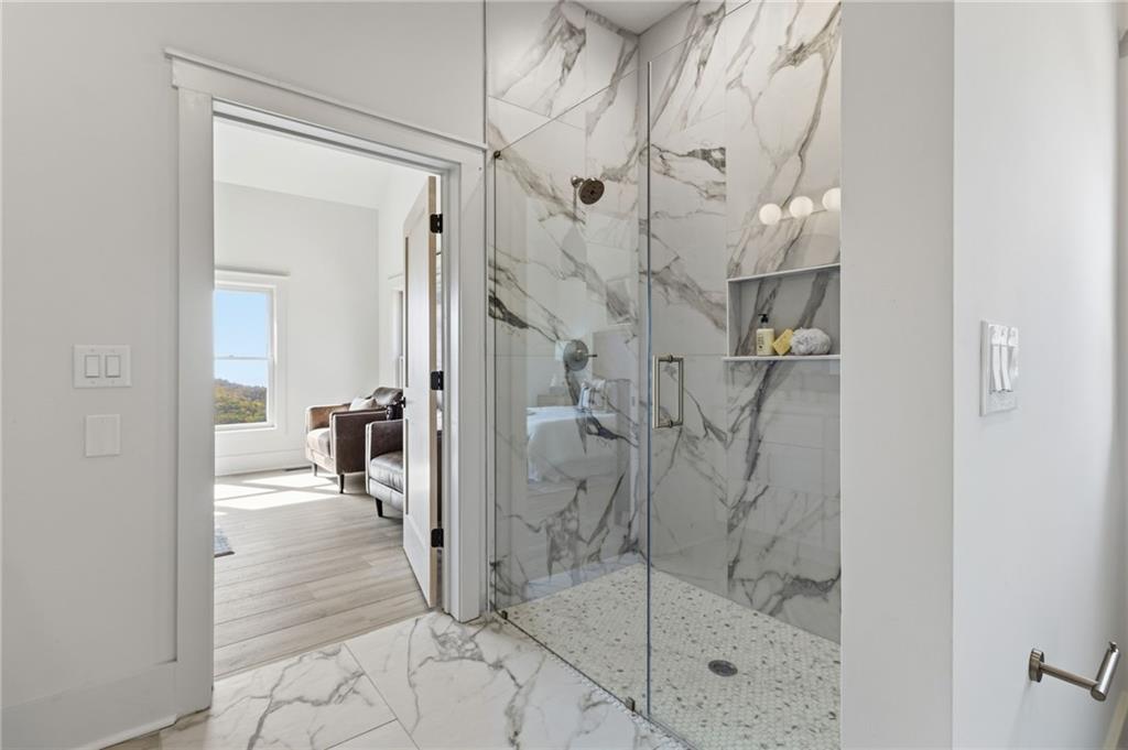 5510 Monument Road Jasper, GA 30143 - Photo 21 of 58 a bathroom with a glass shower door