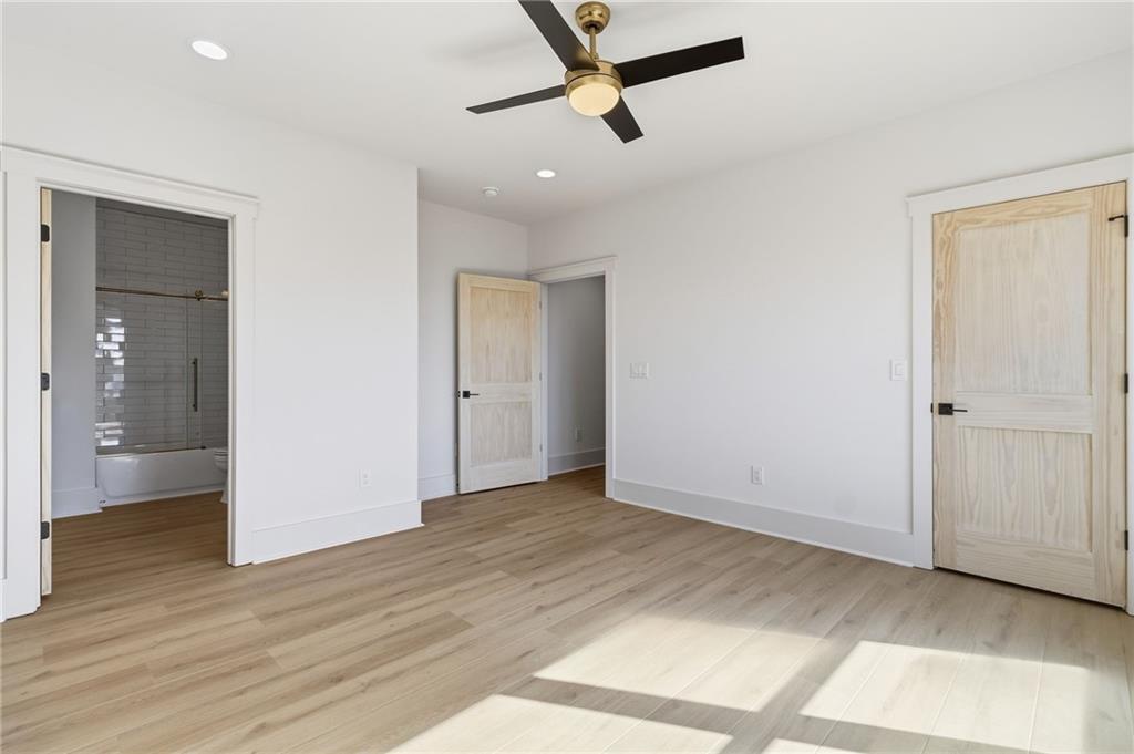 5510 Monument Road Jasper, GA 30143 - Photo 32 of 58 an empty room with wooden floor and windows