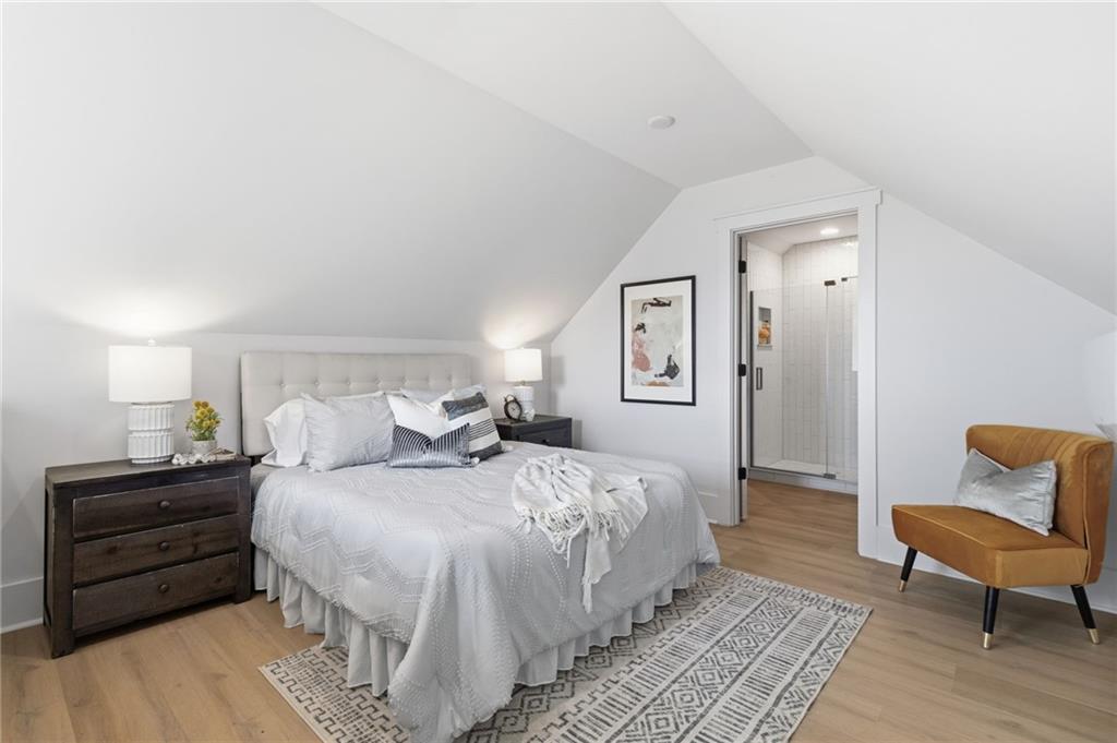 5510 Monument Road Jasper, GA 30143 - Photo 36 of 58 a bedroom with a bed and a chair