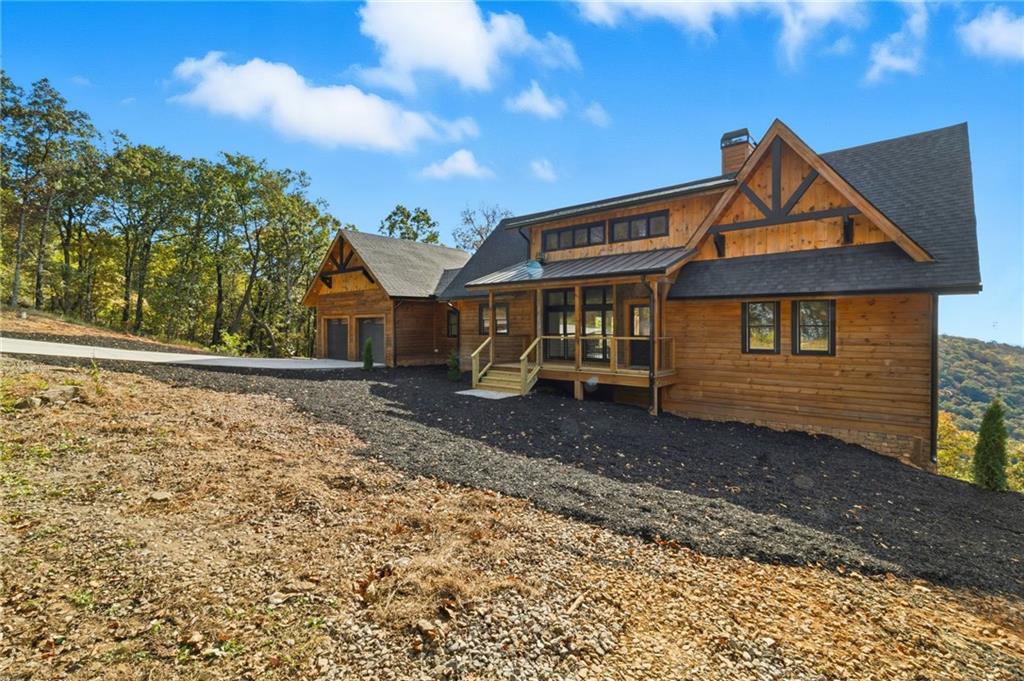 5510 Monument Road Jasper, GA 30143 - Photo 45 of 58 a front view of a house with garden