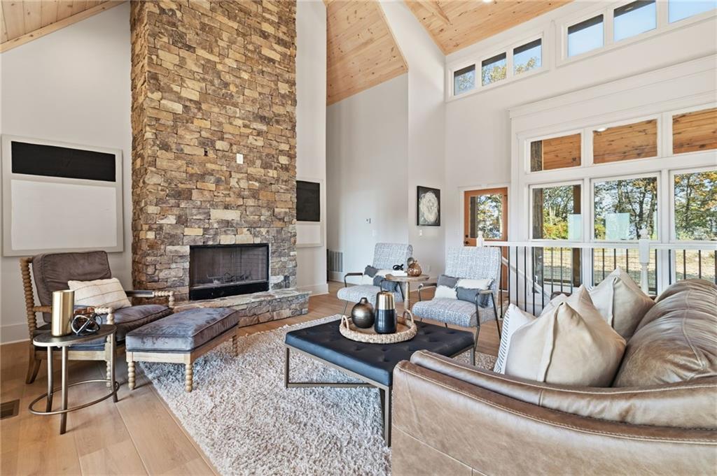 5510 Monument Road Jasper, GA 30143 - Photo 7 of 58 a living room with furniture fireplace and a table