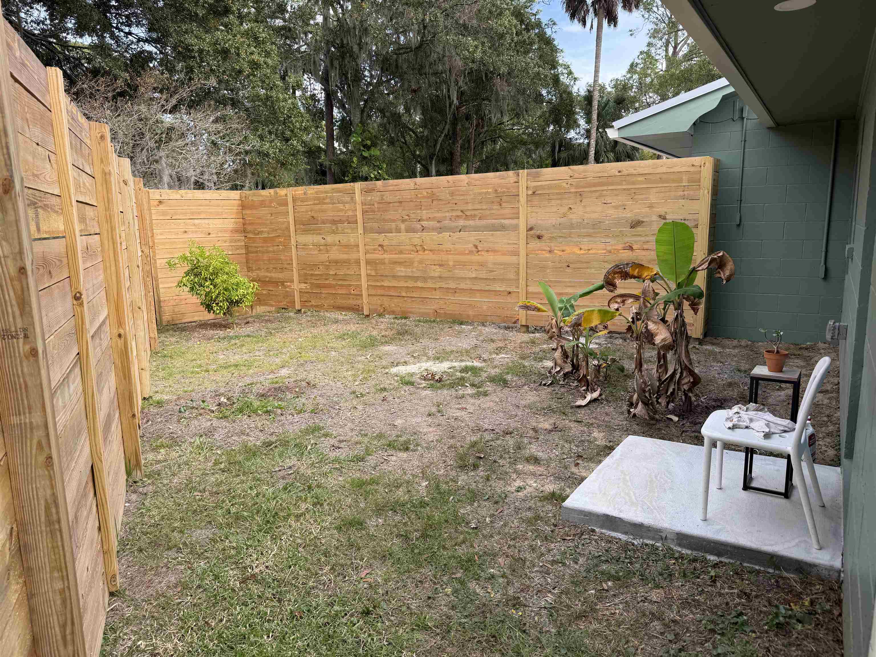 381 Fortuna Avenue, Unit 1 BEDROOM APARTMENT St. Augustine, FL 32084 - Photo 11 of 14 a view of a backyard with chairs