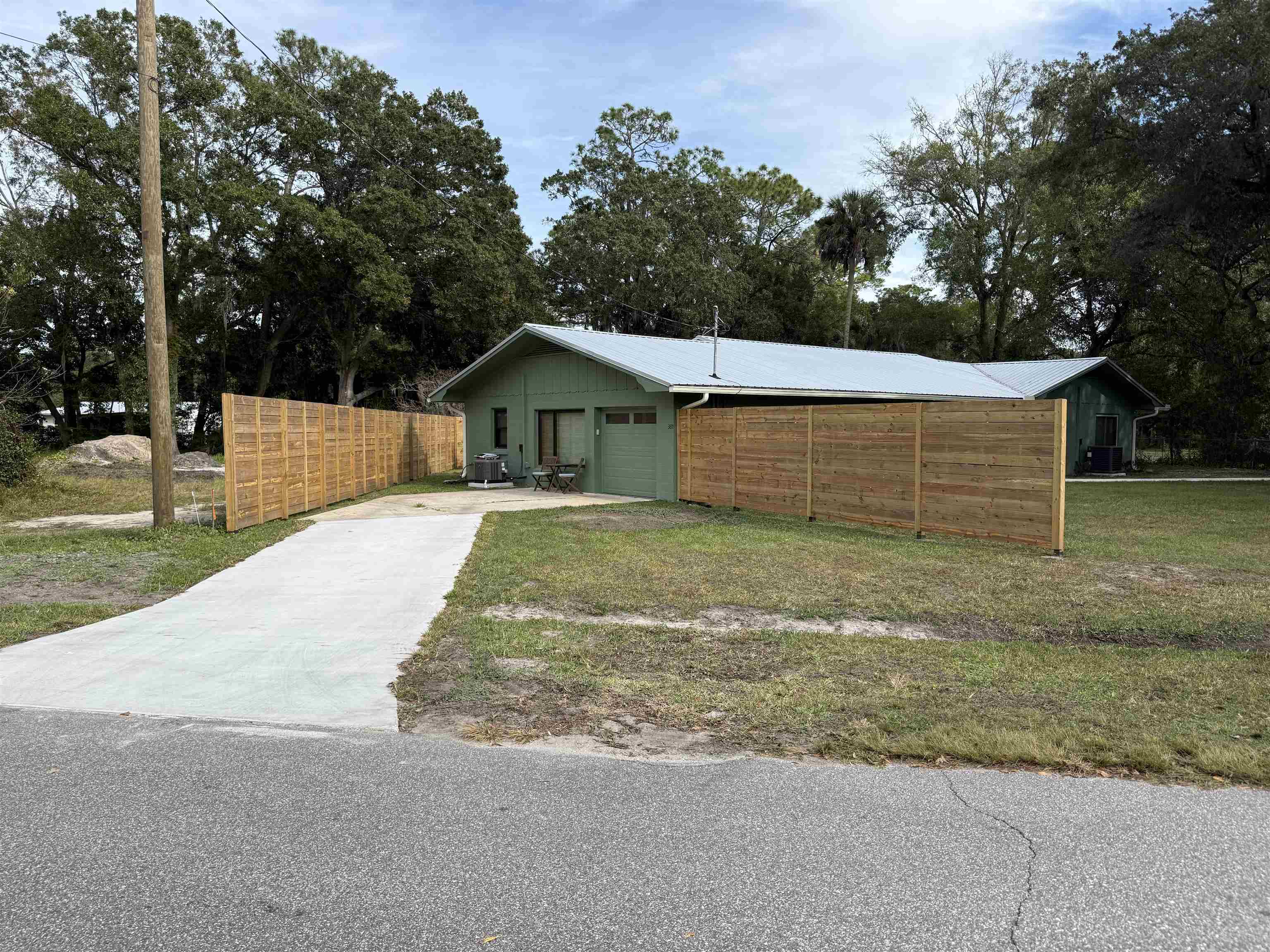 381 Fortuna Avenue, Unit 1 BEDROOM APARTMENT St. Augustine, FL 32084 - Photo 12 of 14 a front view of a house with a yard