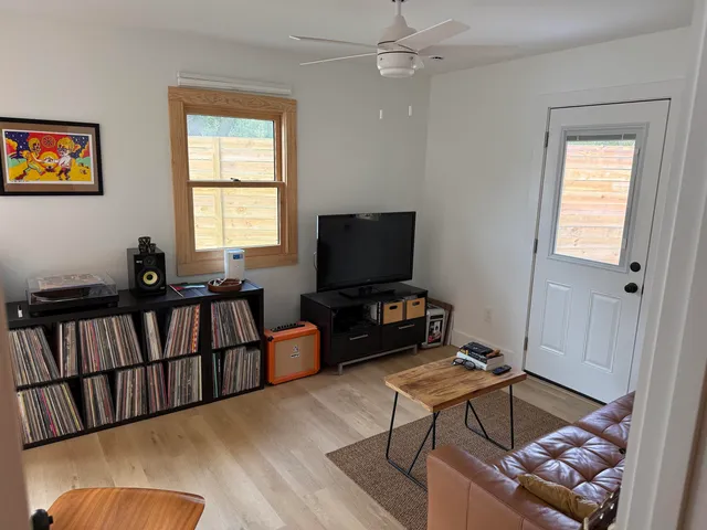 a living room with furniture and a flat screen tv