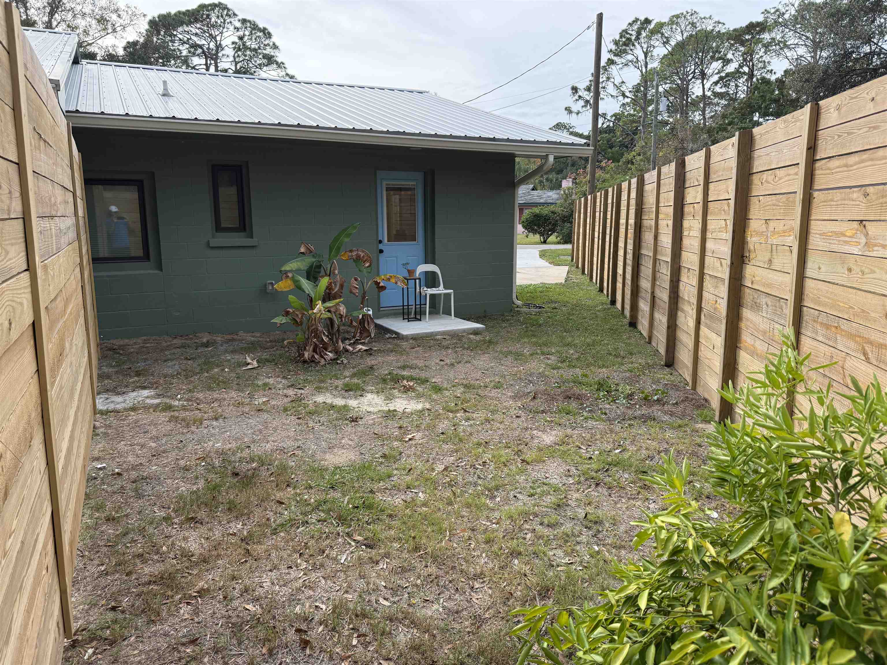 381 Fortuna Avenue, Unit 1 BEDROOM APARTMENT St. Augustine, FL 32084 - Photo 10 of 14 a view of a porch with furniture and garden