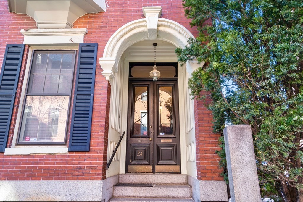 24 Harvard Street, Unit 4 Boston, MA 02129 - Photo 11 of 17 a view of a brick house with large windows