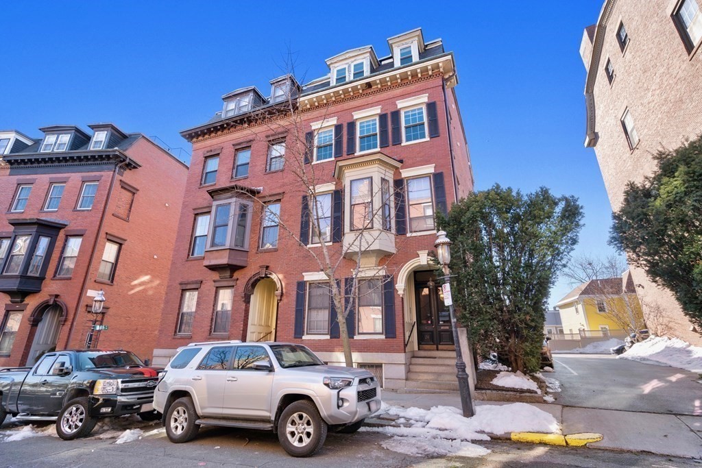 24 Harvard Street, Unit 4 Boston, MA 02129 - Photo 12 of 17 a car parked in front of a building