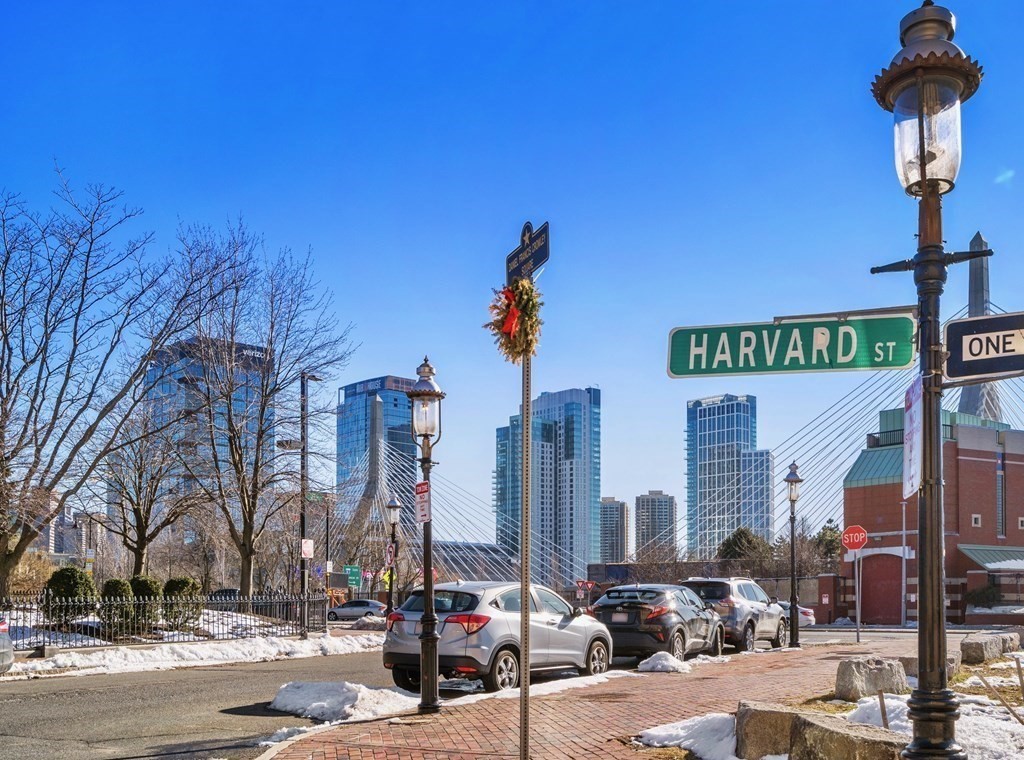 24 Harvard Street, Unit 4 Boston, MA 02129 - Photo 15 of 17 a street sign on a street corner