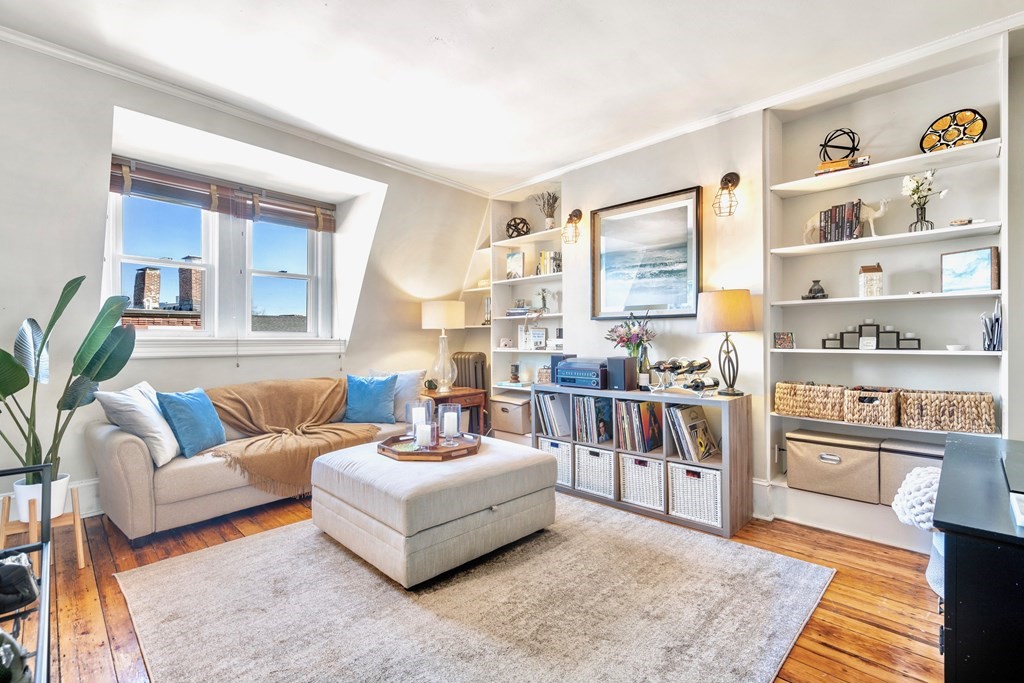 24 Harvard Street, Unit 4 Boston, MA 02129 - Photo 2 of 17 a living room with furniture and a book shelf