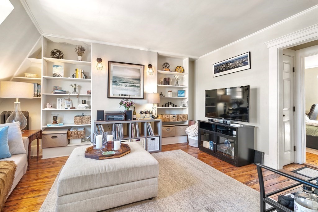 24 Harvard Street, Unit 4 Boston, MA 02129 - Photo 3 of 17 a living room with furniture and a flat screen tv