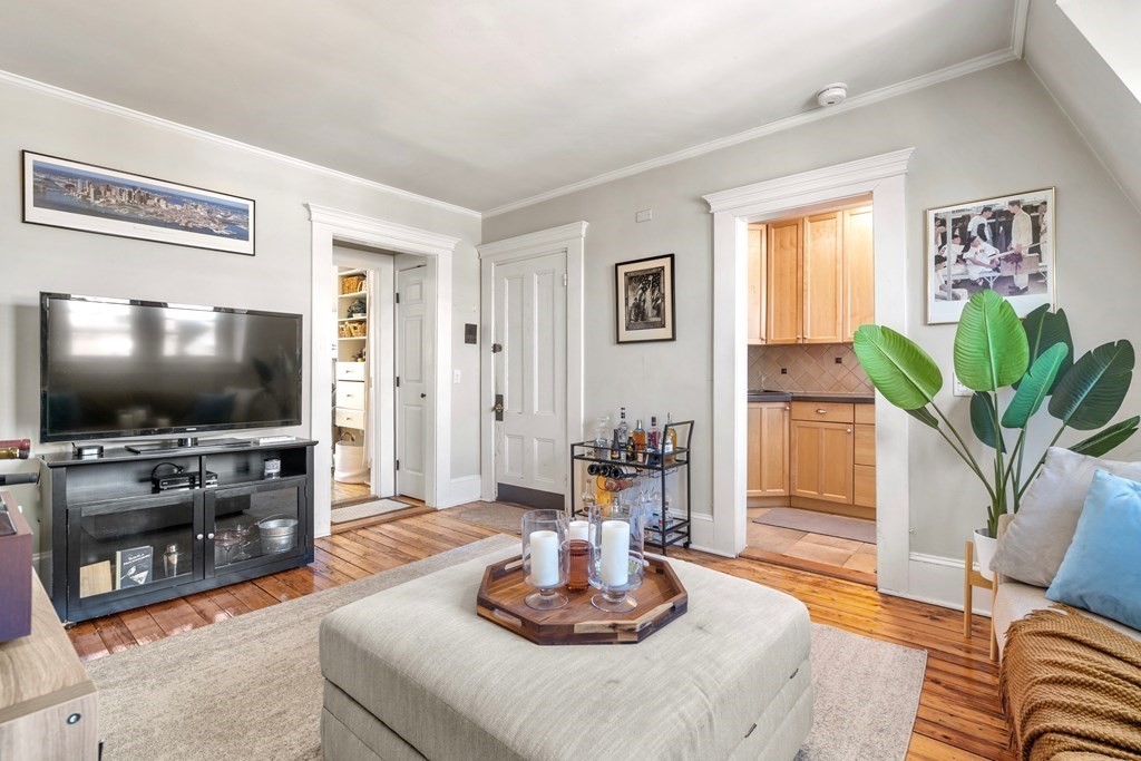 24 Harvard Street, Unit 4 Boston, MA 02129 - Photo 5 of 17 a living room with furniture and a flat screen tv