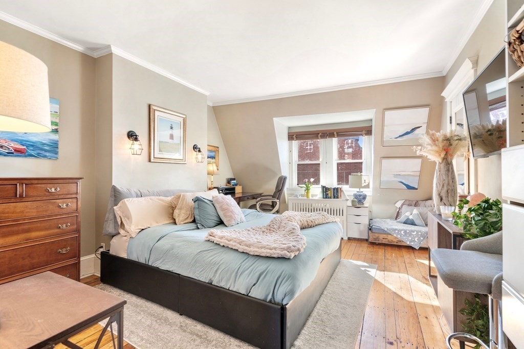 24 Harvard Street, Unit 4 Boston, MA 02129 - Photo 7 of 17 a living room with furniture and a large window