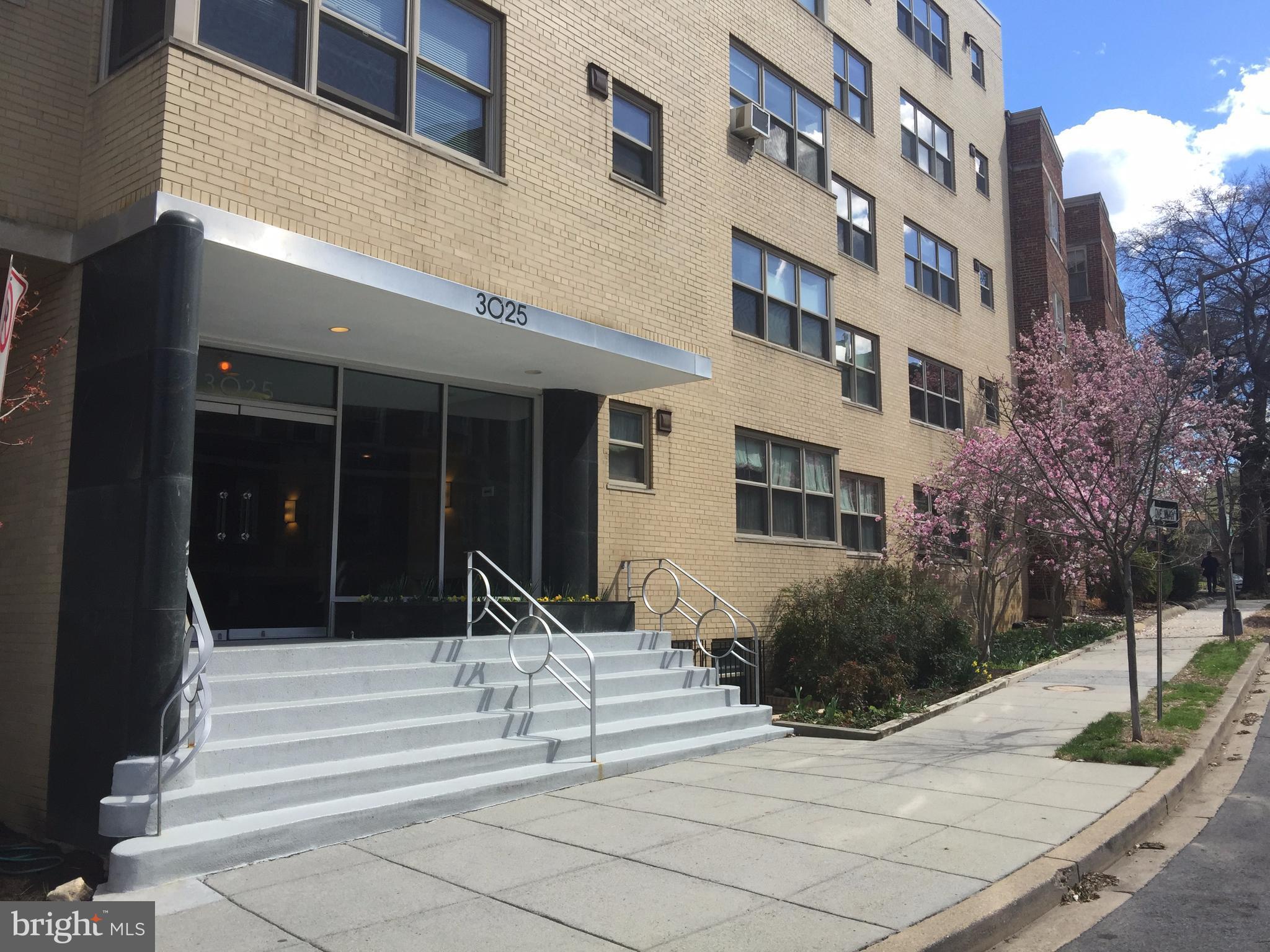 3025 Ontario Road Northwest, Unit 105 Washington, DC 20009 - Photo 1 of 26 a view of a building with stairs and windows