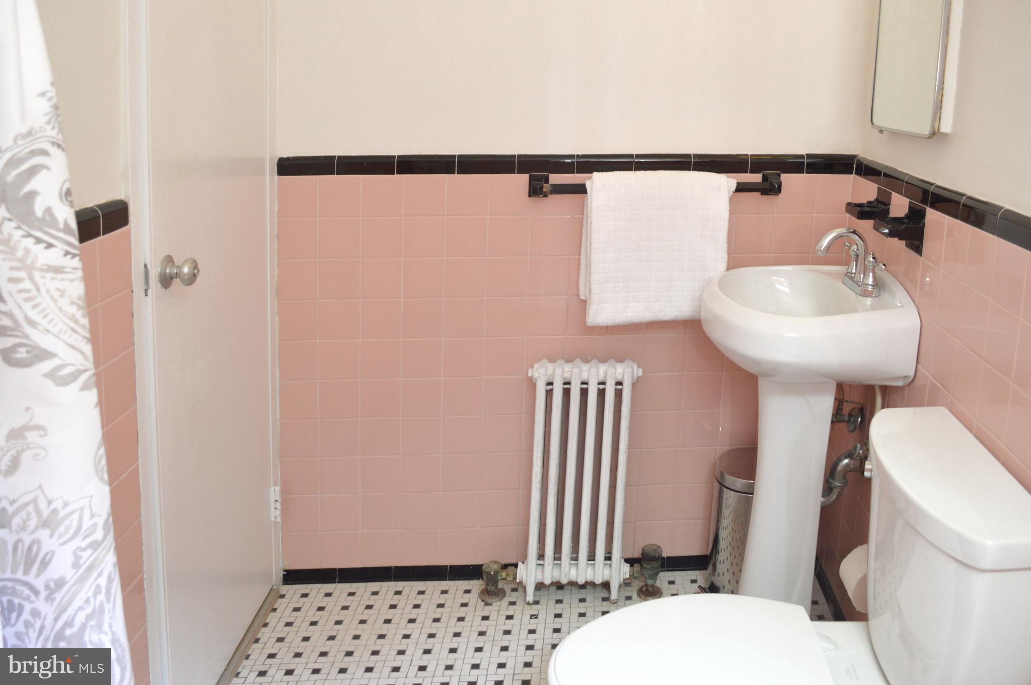 3025 Ontario Road Northwest, Unit 105 Washington, DC 20009 - Photo 16 of 26 a bathroom with a sink and toilet