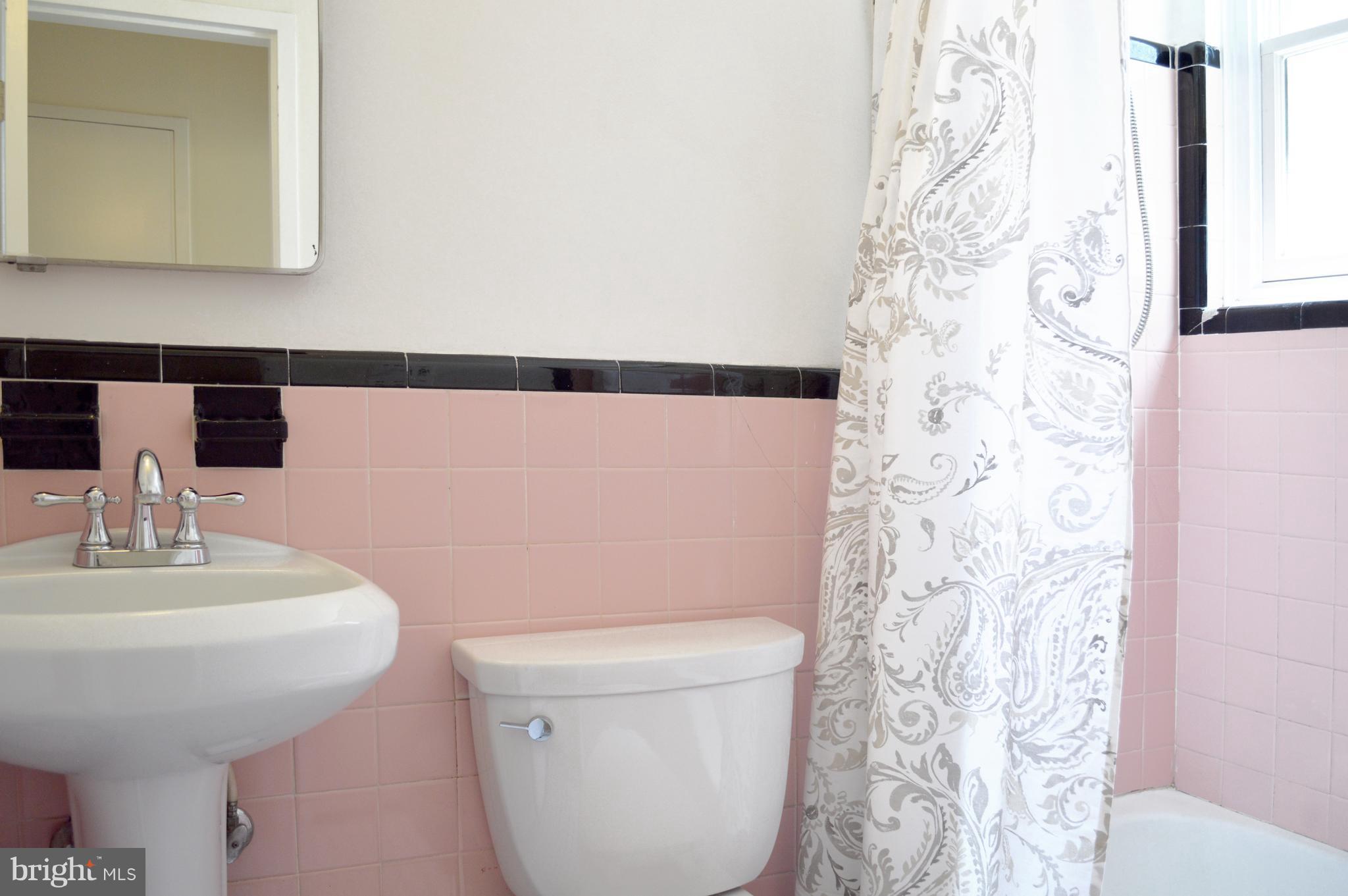 3025 Ontario Road Northwest, Unit 105 Washington, DC 20009 - Photo 17 of 26 a bathroom with a sink and toilet