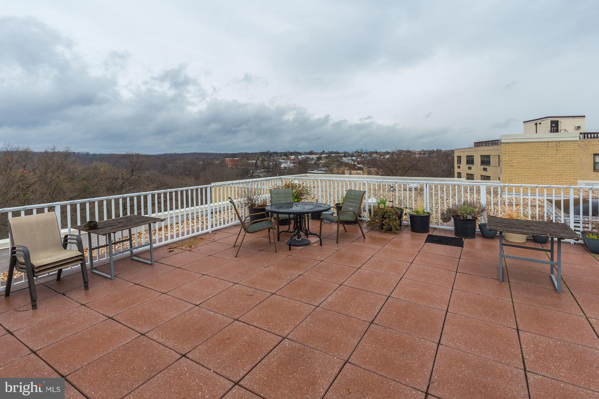 3025 Ontario Road Northwest, Unit 105 Washington, DC 20009 - Photo 19 of 26 a view of a terrace with furniture
