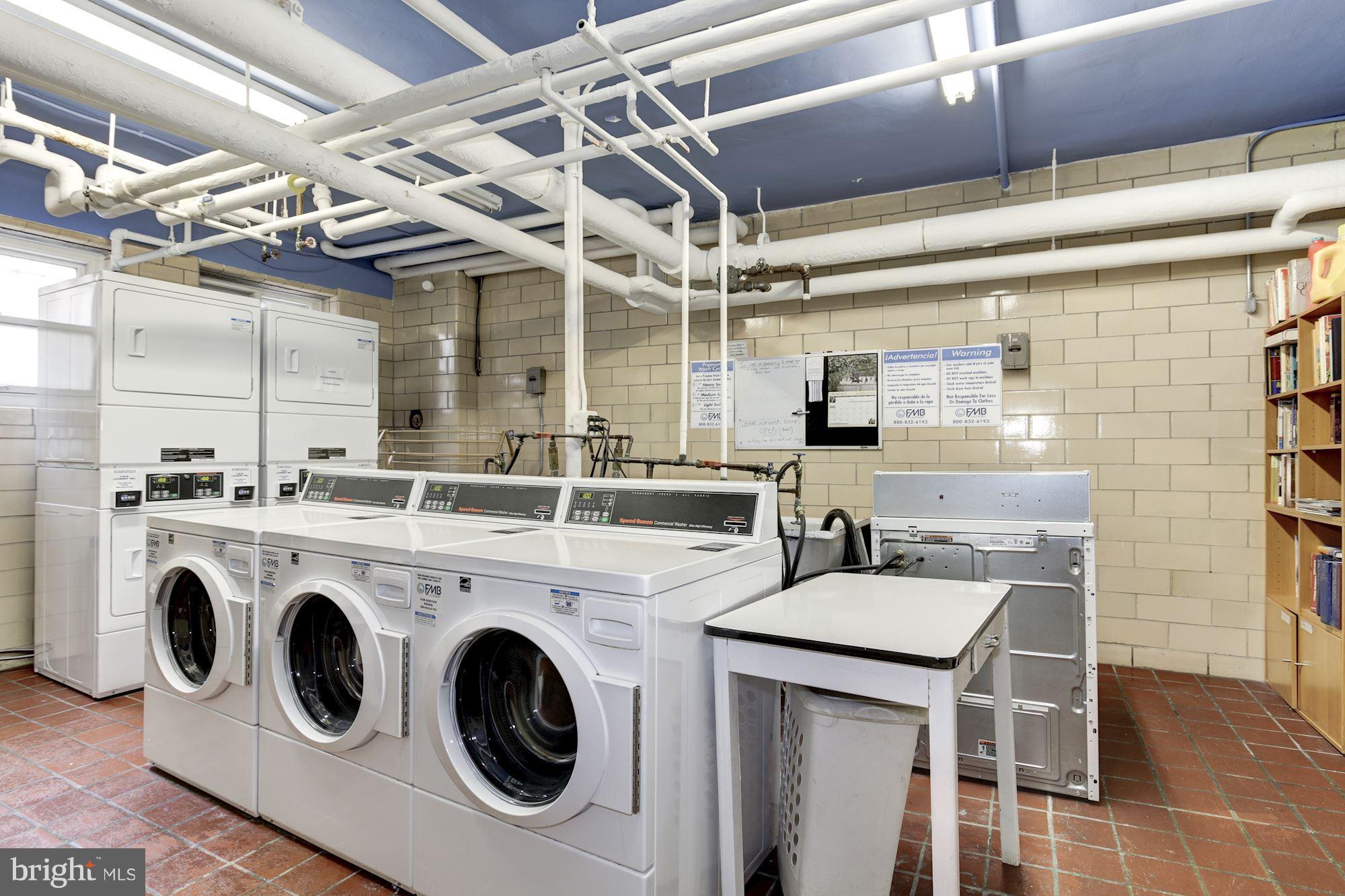 3025 Ontario Road Northwest, Unit 105 Washington, DC 20009 - Photo 23 of 26 a utility room with dryer and washer