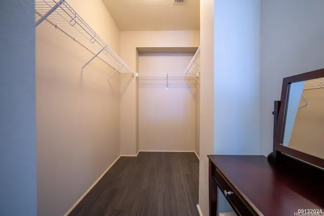 a view of a workspace with furniture and wooden floor