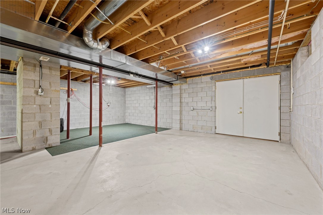 5100 McCormick Road Ravenna, OH 44266 - Photo 23 of 34 Walk out basement set up for a pellet stove that is connected to the ductwork