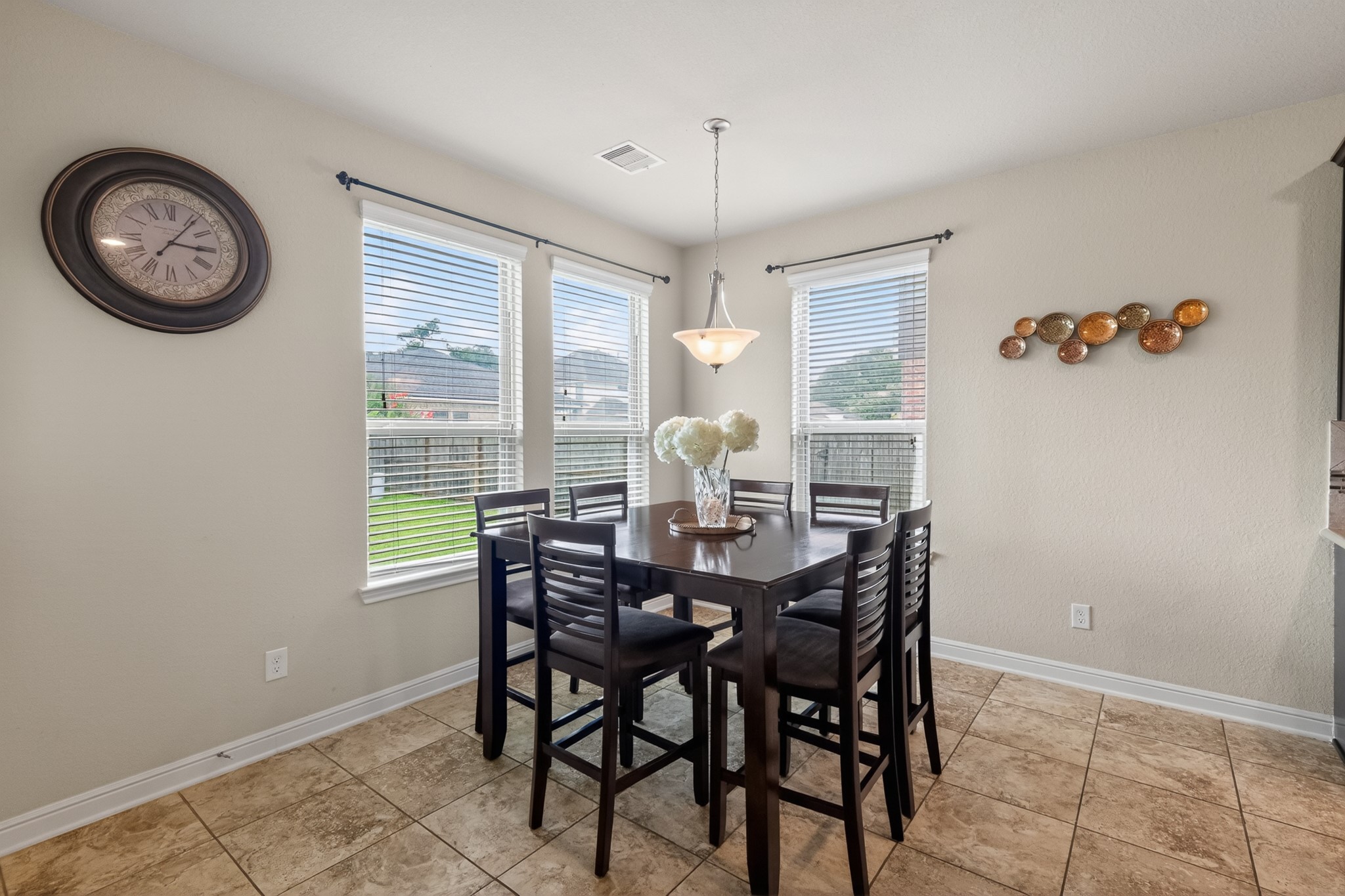 24711 East Burnaby Circle Spring, TX 77373 - Photo 7 of 20 a view of a dining room with furniture and a large window