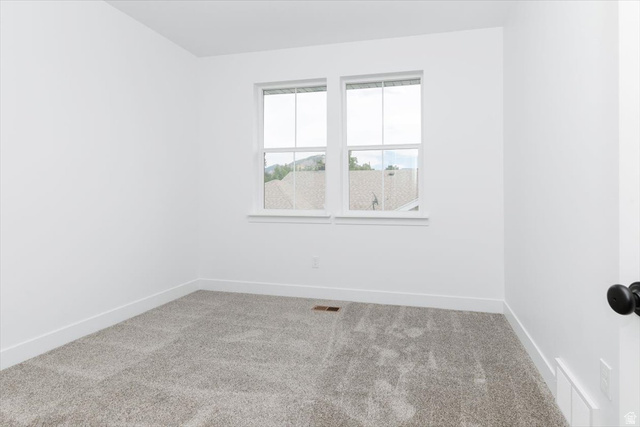 314 North 200 West Logan, UT 84321 - Photo 21 of 37 Empty room featuring carpet floors and baseboards