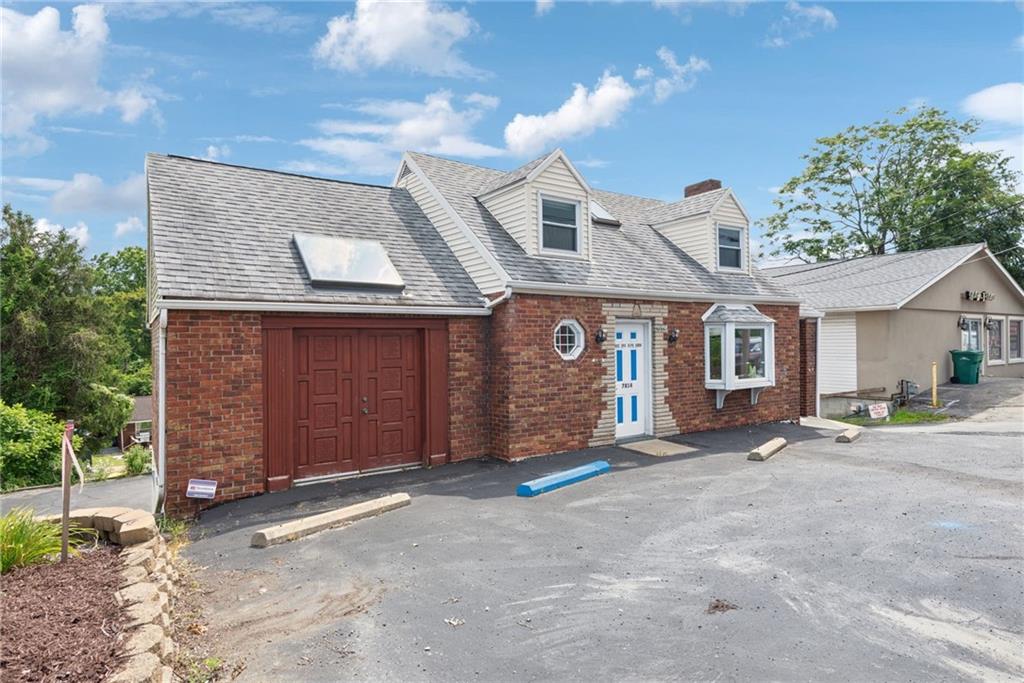 a view of a house with a space and parking space