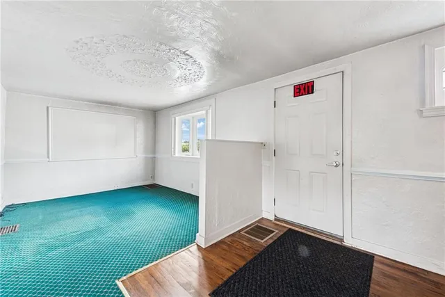 a bathroom with a sink a toilet and shower curtain