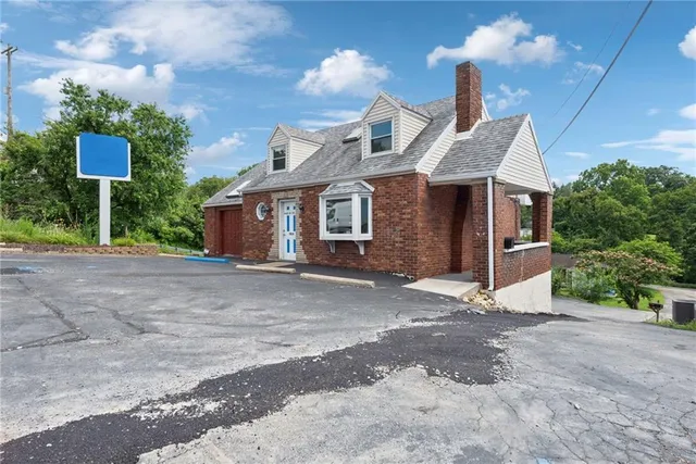 a view of a house with a street