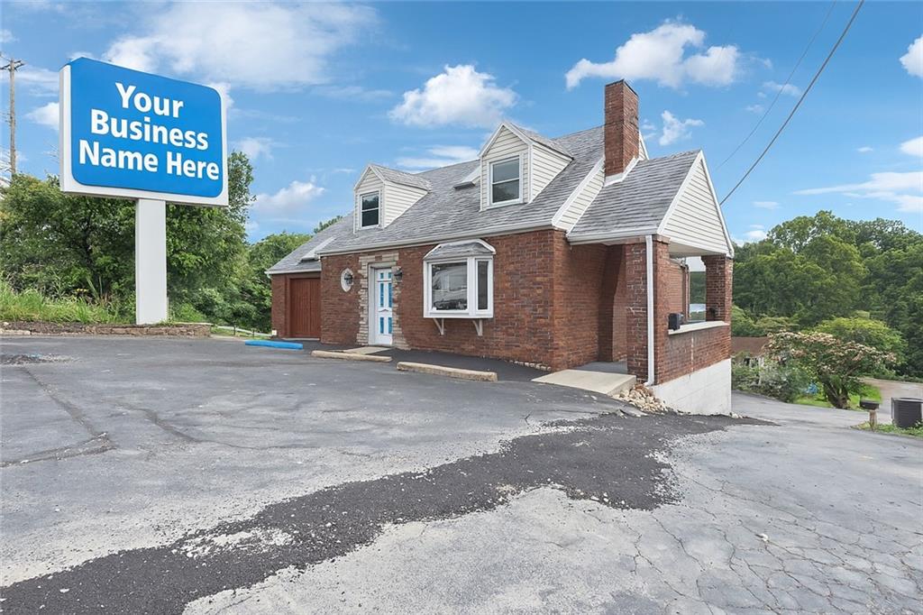 7814 Highway 30 Irwin, PA 15642 - Photo 5 of 30 a view of a house with a yard and garage