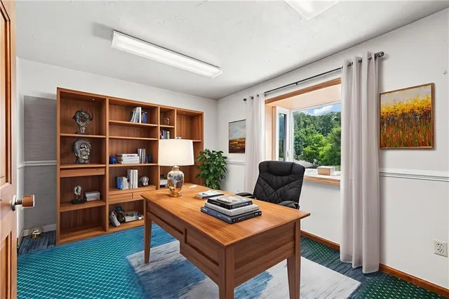 a living room with furniture pool table and a window