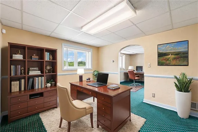 a workspace with furniture and rug