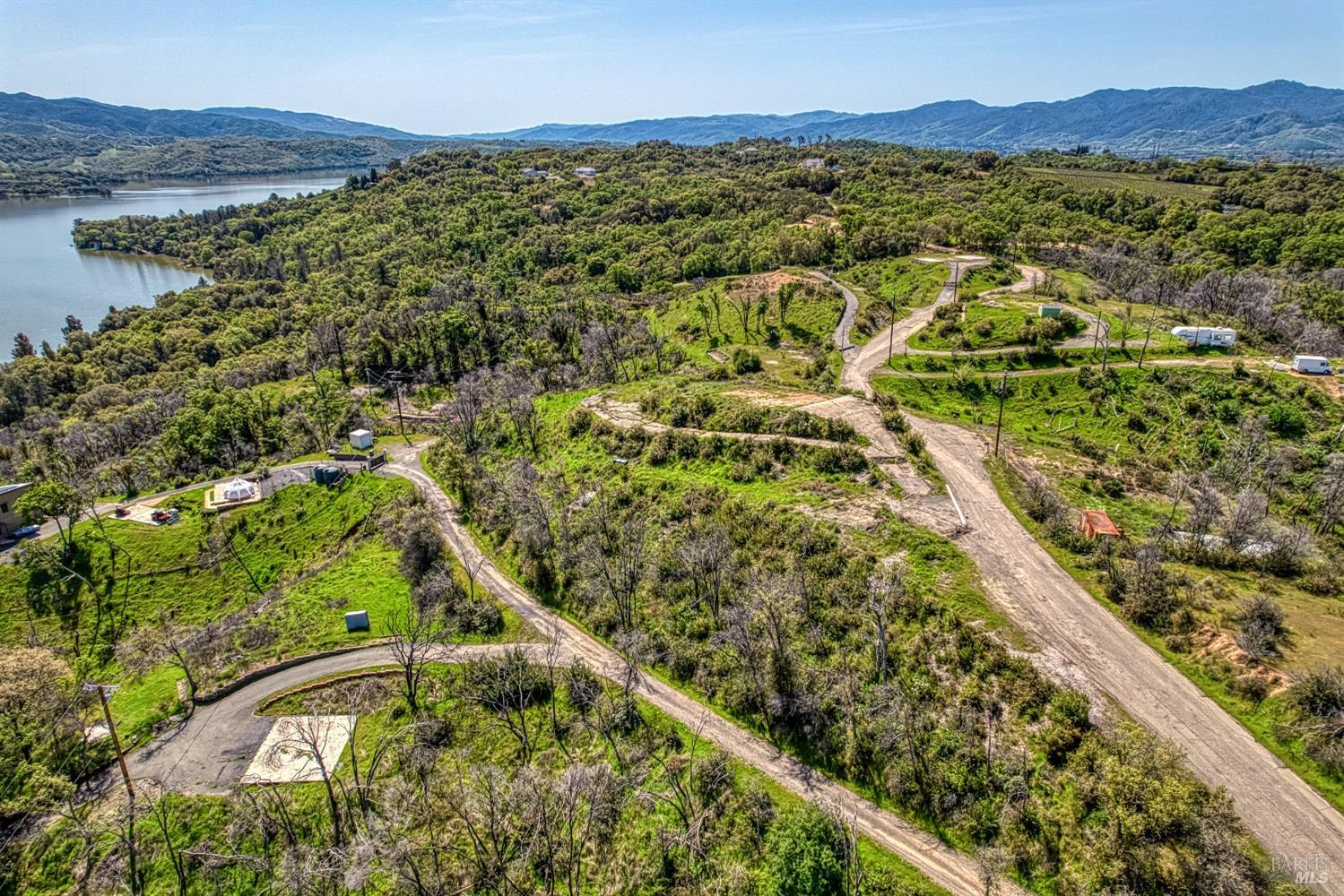 a view of a city with mountains in the background