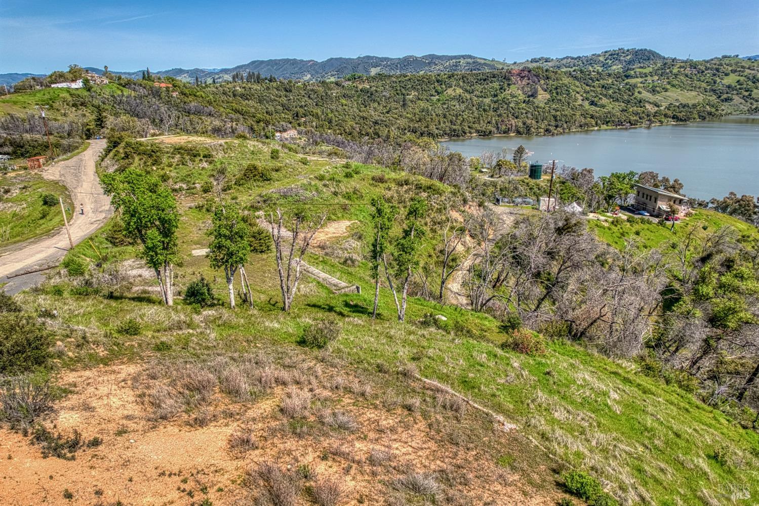 5801 Lake Ridge Road Ukiah, CA 95482 - Photo 18 of 21 a view of a lake with mountains in the background
