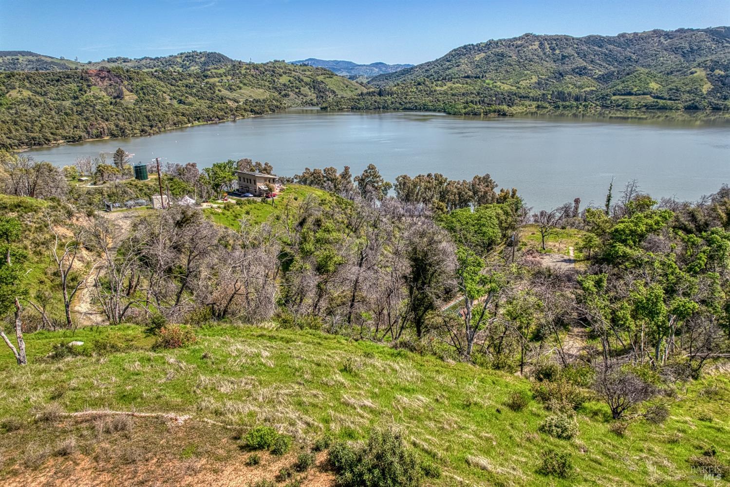 5801 Lake Ridge Road Ukiah, CA 95482 - Photo 4 of 21 a view of a lake with a mountain in the background