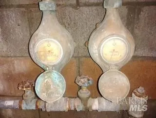 a bathroom with a toilet and a mirror