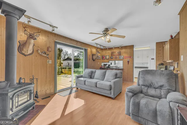 a view of a hallway with wooden floor and entryway