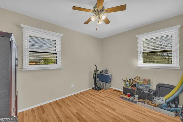 a bedroom with a large bed and a window