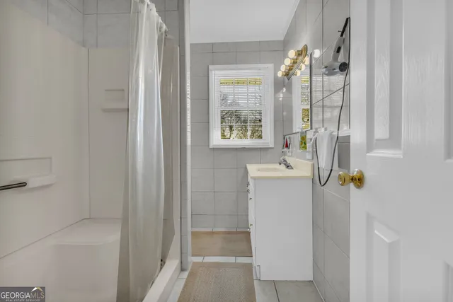 a bathroom with a sink and a window