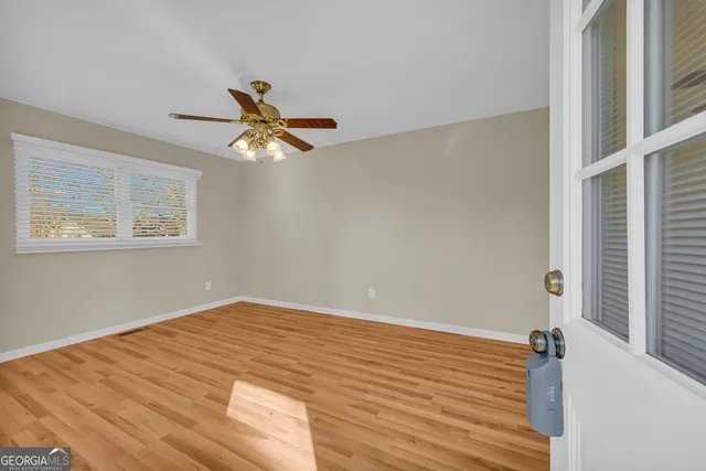 a kitchen with granite countertop a sink and cabinets