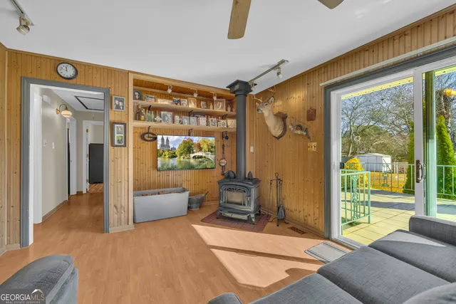 a spacious bedroom with a large window and a bed