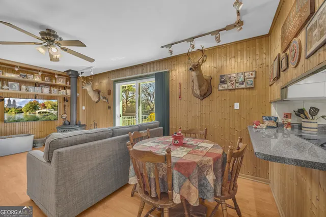 a dining room with furniture and window