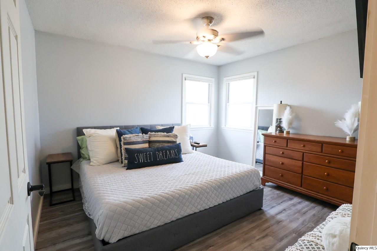 4400 State Street Quincy, IL 62305 - Photo 6 of 31 a bedroom with a bed and ceiling fan