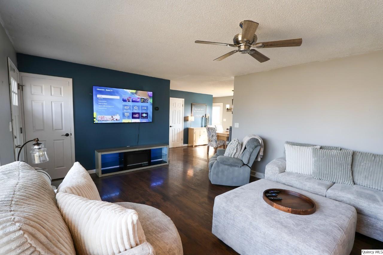 4400 State Street Quincy, IL 62305 - Photo 7 of 31 a living room with furniture and a flat screen tv