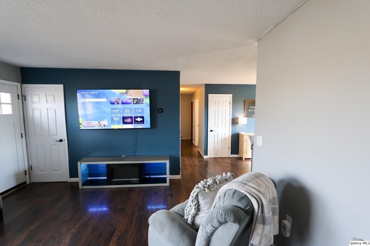 4400 State Street Quincy, IL 62305 - Photo 8 of 31 a view of a livingroom with furniture and a flat screen tv