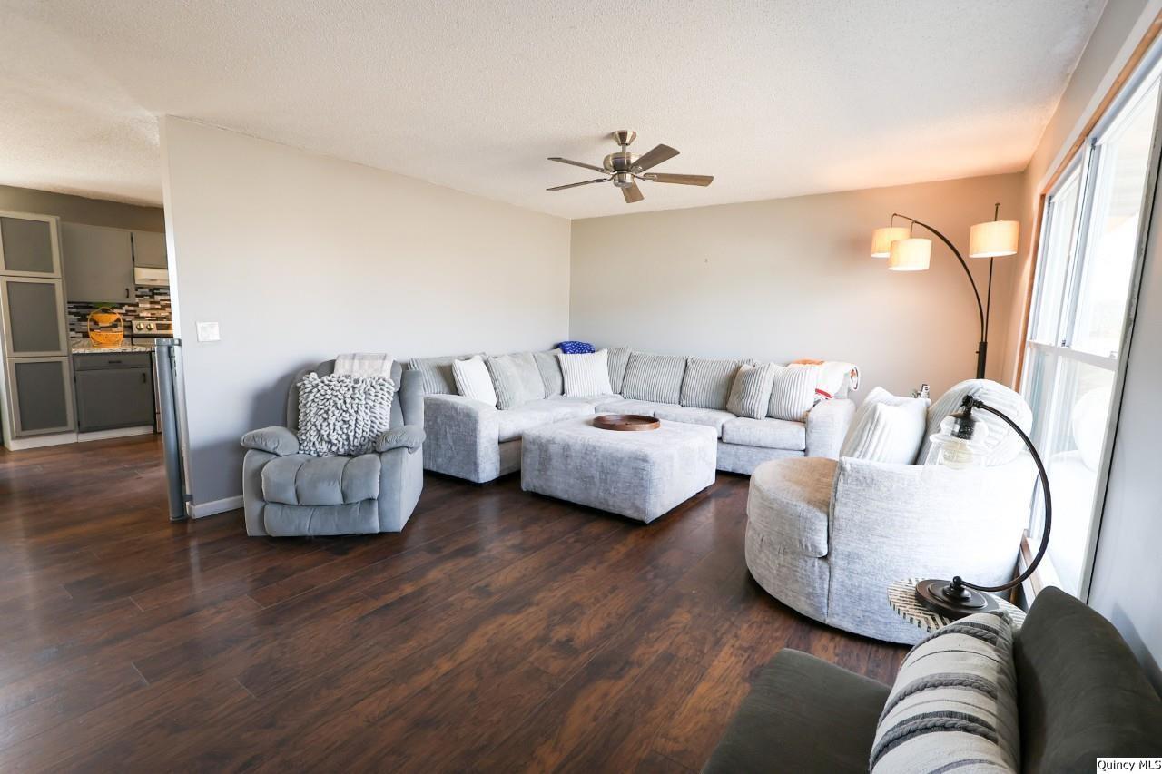 4400 State Street Quincy, IL 62305 - Photo 9 of 31 a living room with furniture and a wooden floor