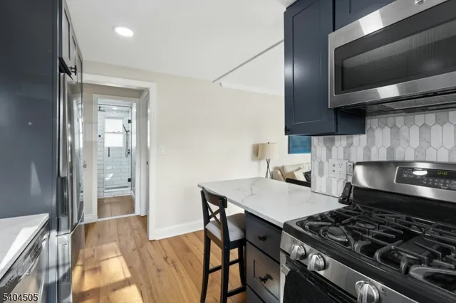 a kitchen with a stove and a microwave
