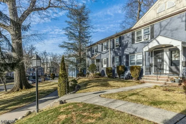 a view of a building with a yard