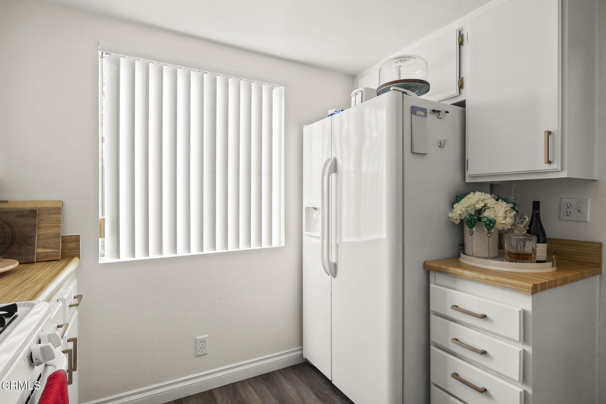3255 Kelp Lane Oxnard, CA 93035 - Photo 17 of 45 a kitchen with a refrigerator and cabinets
