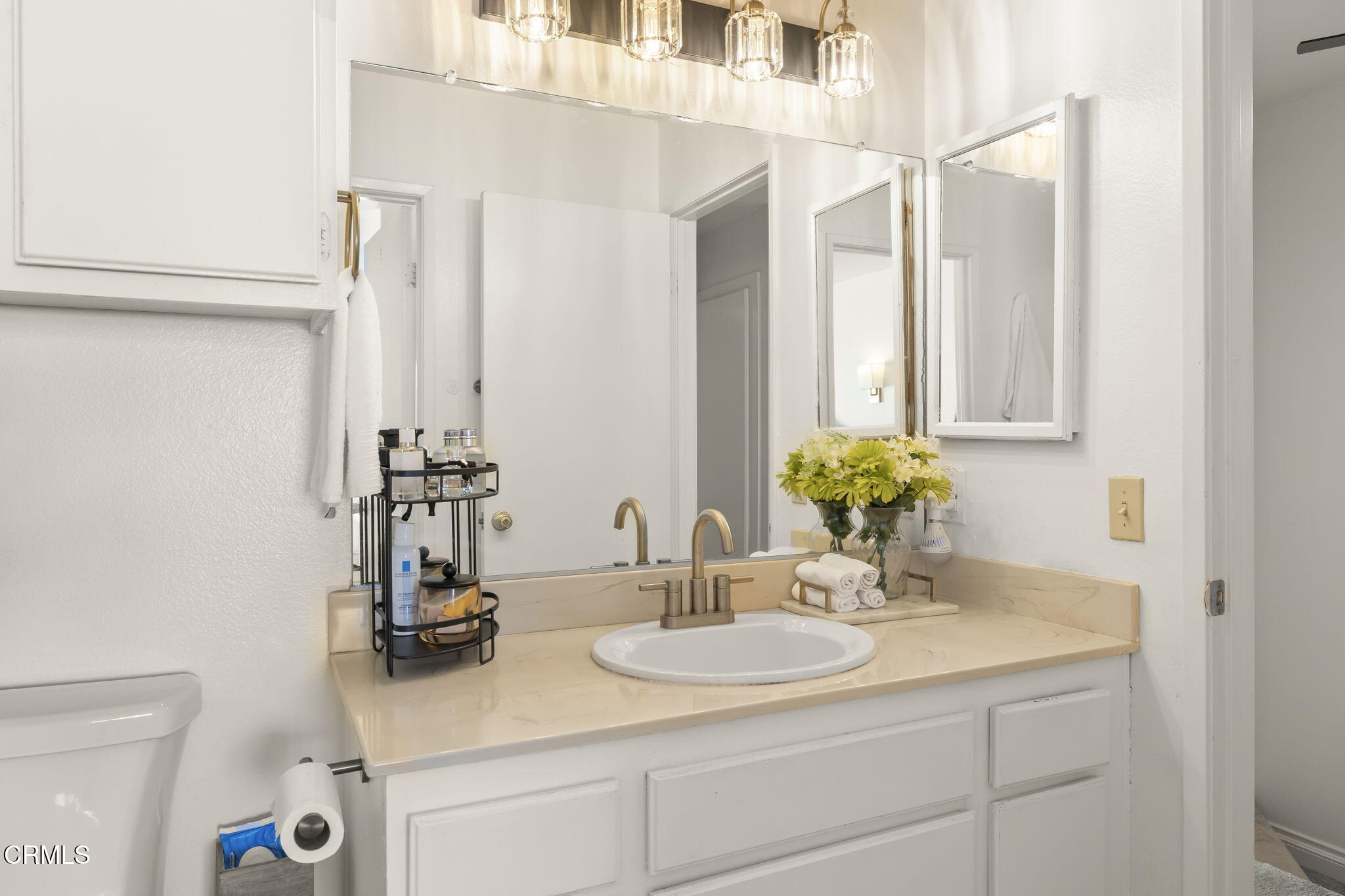 3255 Kelp Lane Oxnard, CA 93035 - Photo 23 of 45 a bathroom with a sink and a mirror