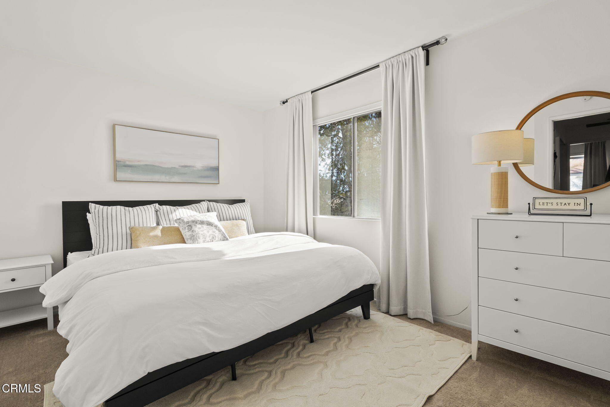 3255 Kelp Lane Oxnard, CA 93035 - Photo 25 of 45 a bedroom with a bed a mirror and dresser